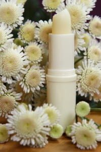 Lip Balm Surrounded by Flowers