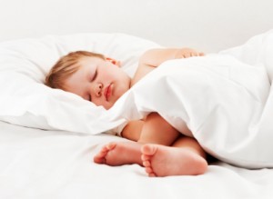Sleeping Child Lying in Bed