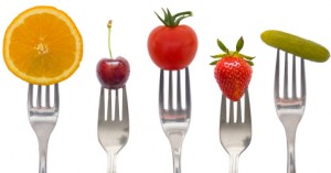 Different Forks Holding Different Fruit